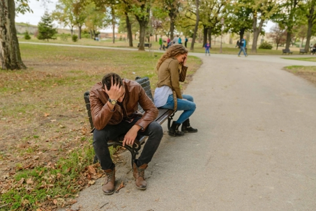 Two People Sitting on a Bench