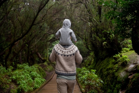 person with baby on shoulders