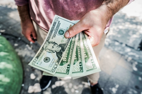 person holding cash money